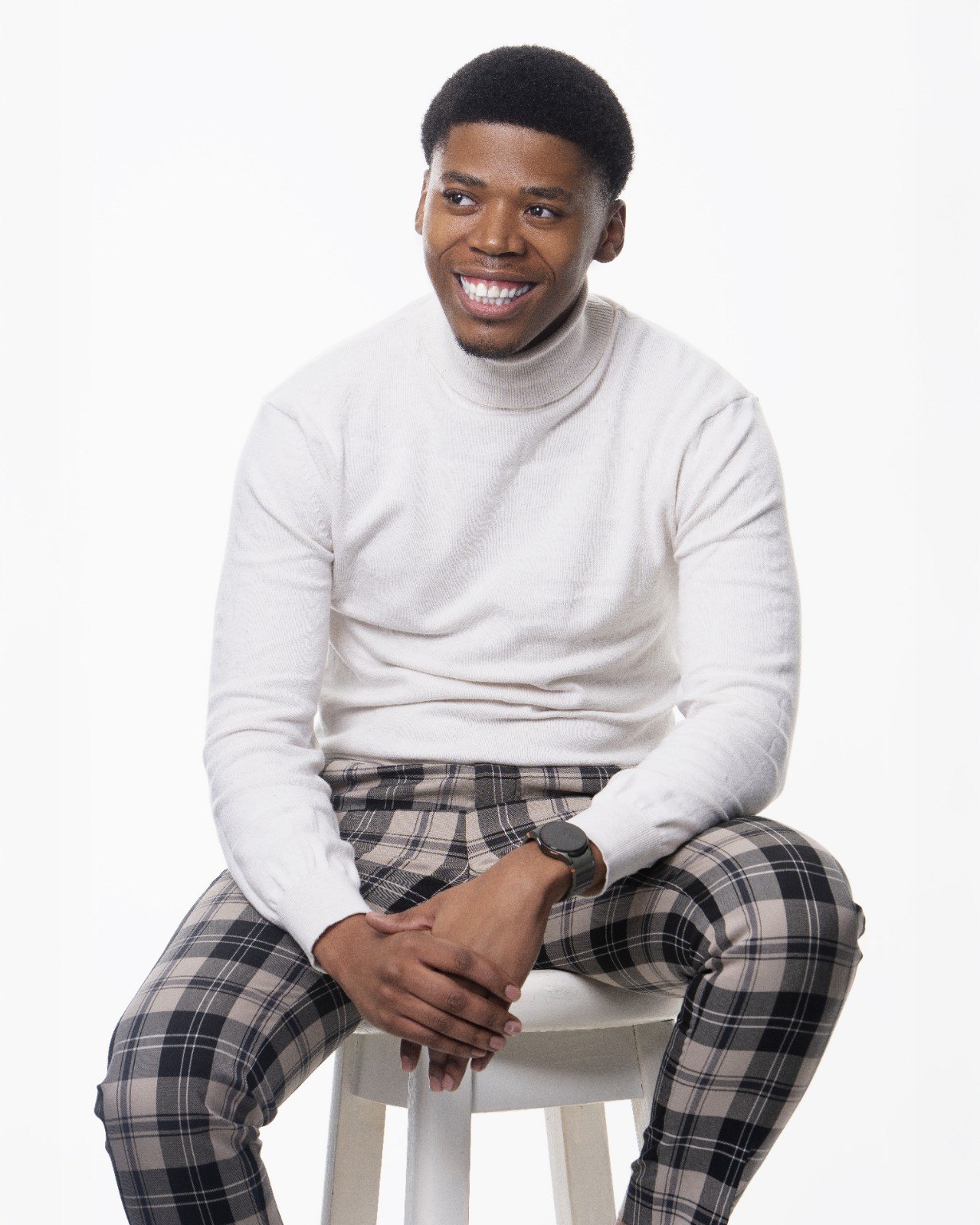 Dr. Kamo Tjelele seated in a professional portrait